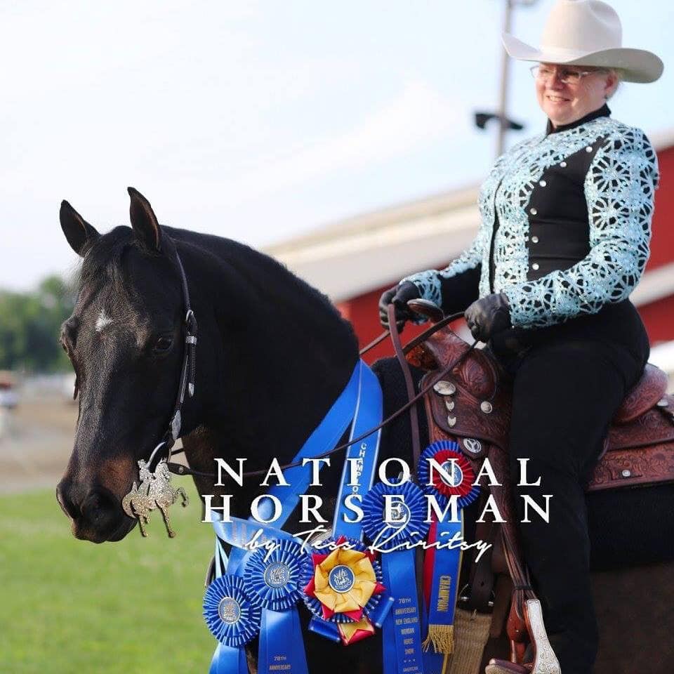 Lindsay Naas riding Belle with many championship ribbons